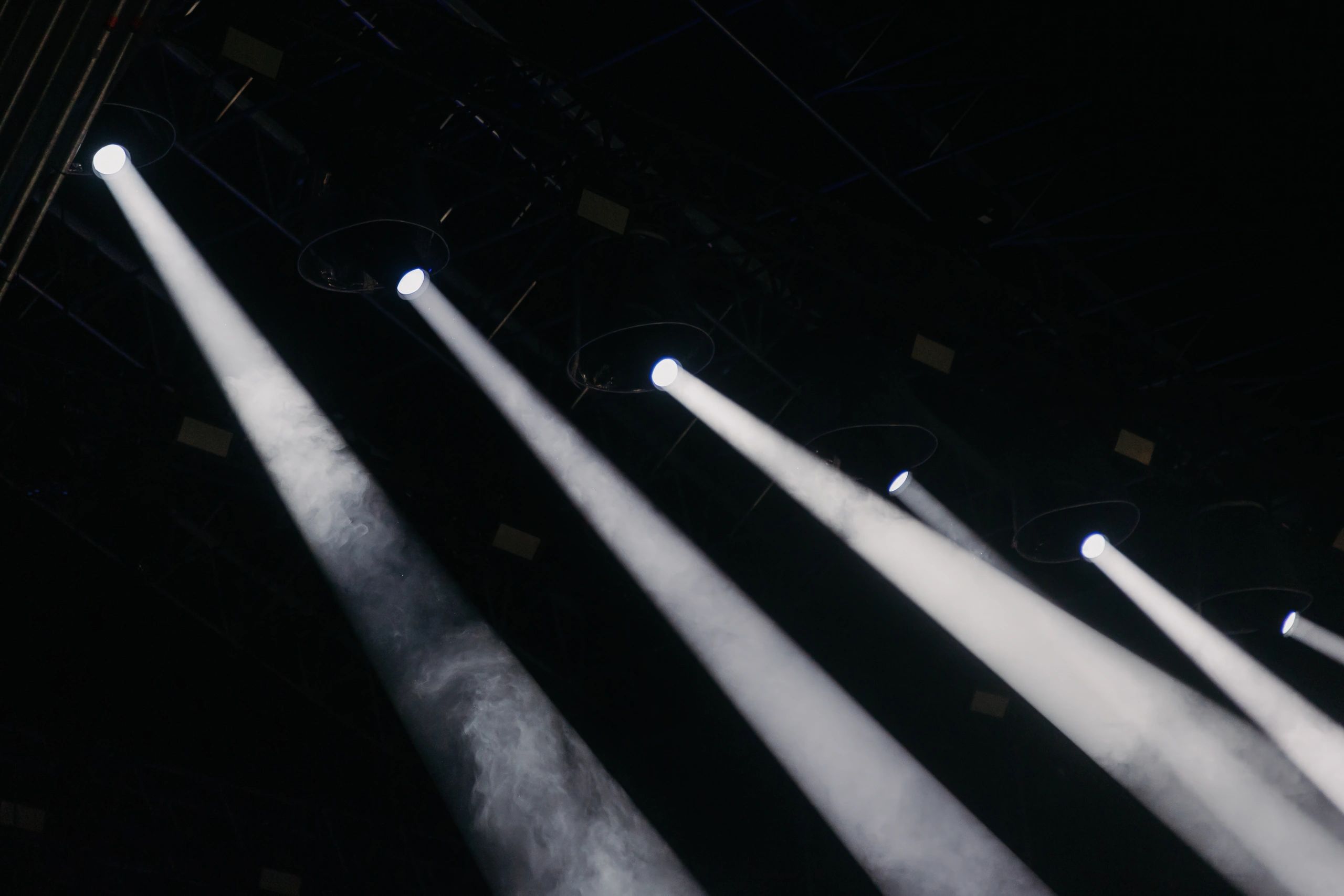 Concert stage lighting rig at night