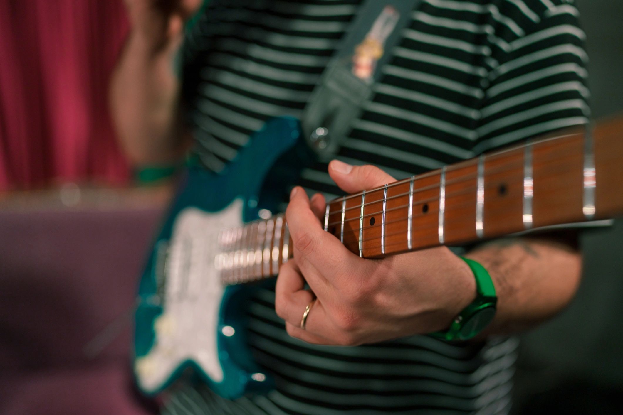 Close-up of electric guitarist performing